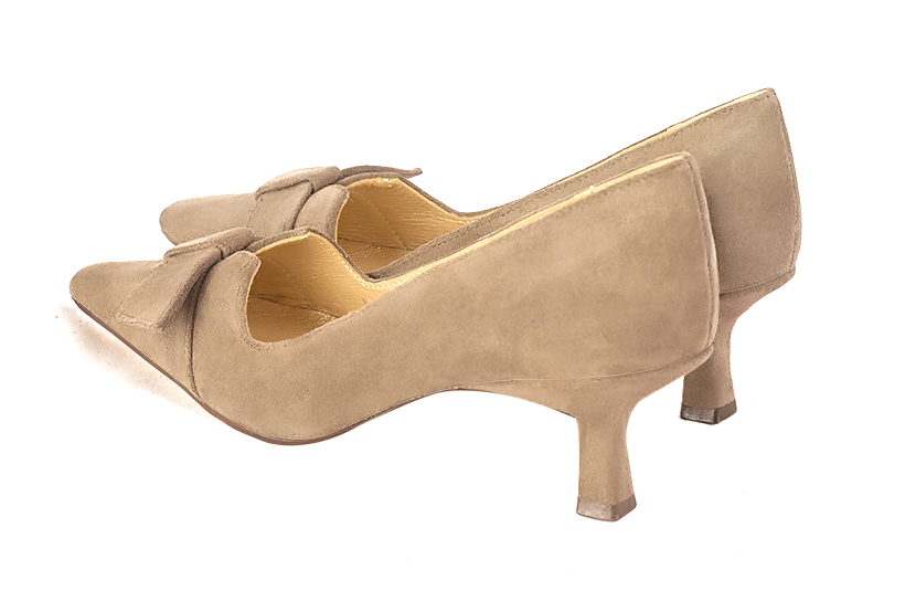 Tan beige women's dress pumps, with a knot on the front. Tapered toe. Medium spool heels. Rear view - Florence KOOIJMAN